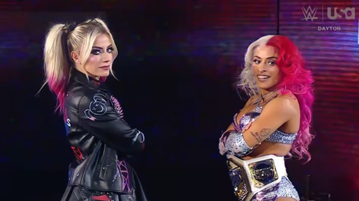 Alexa Bliss standing with Zelina Vega