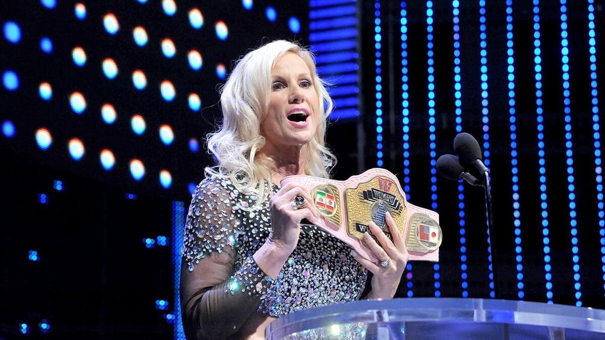 Alundra Blayze/Madusa holding the WWF Women's Title at her WWE Hall of Fame induction 