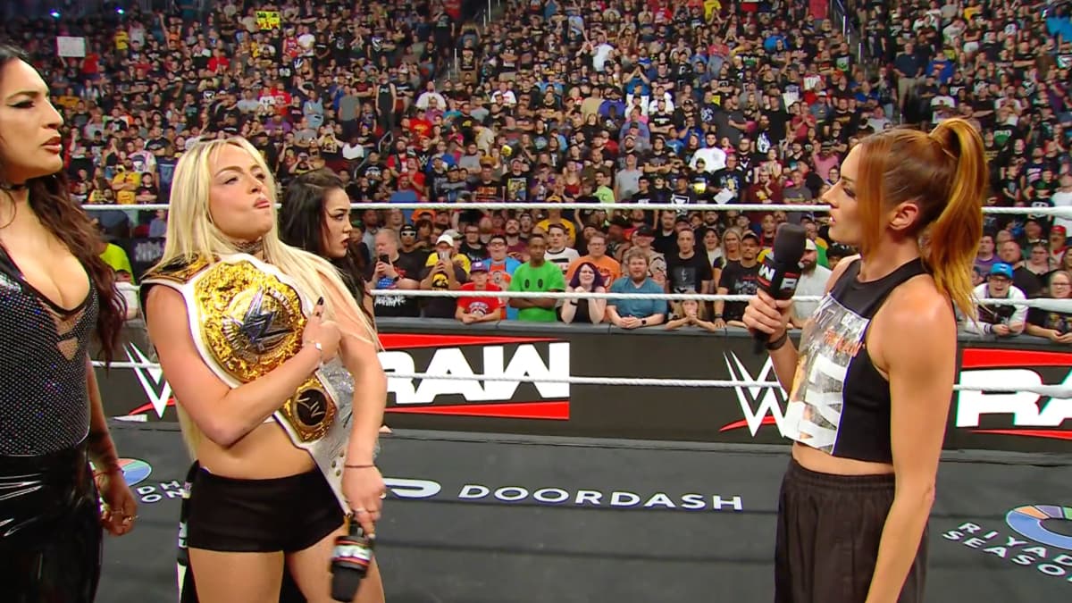Becky Lynch looking at Liv Morgan