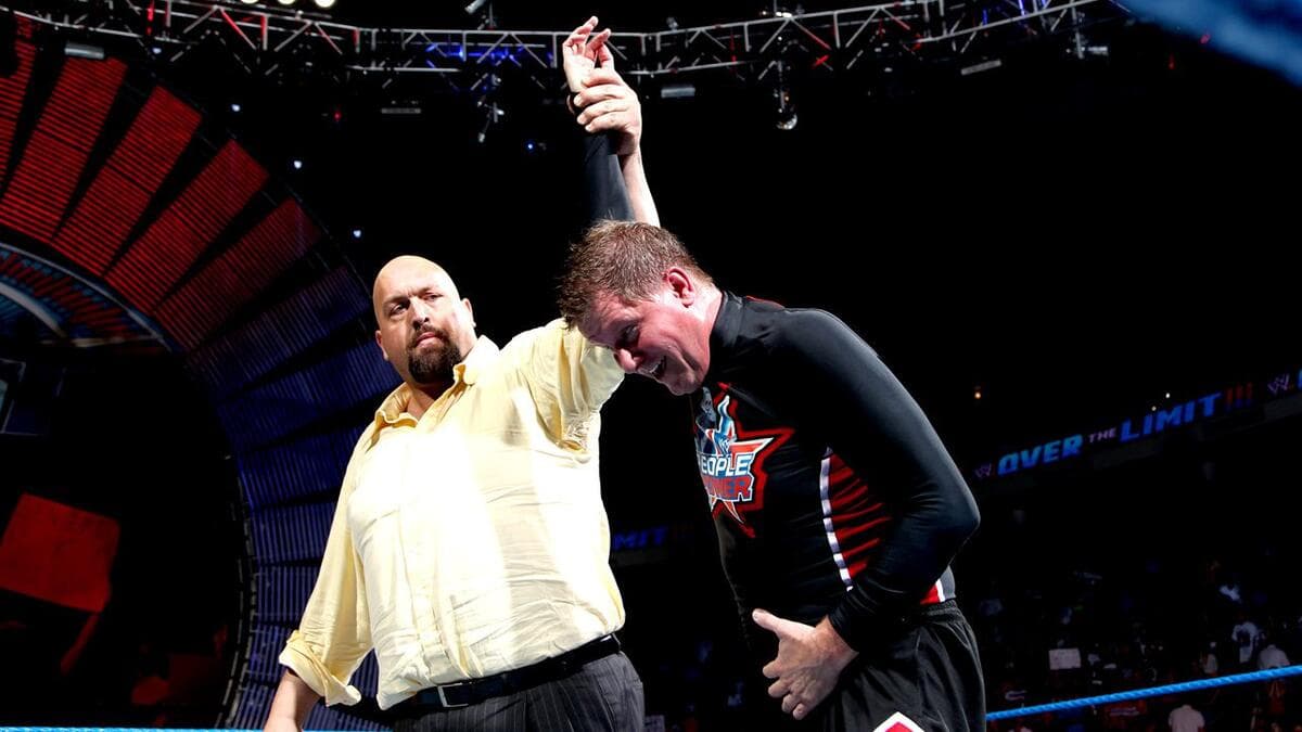 The Big Show holding up John Laurinaitis' arm at WWE Over The Limit 2012