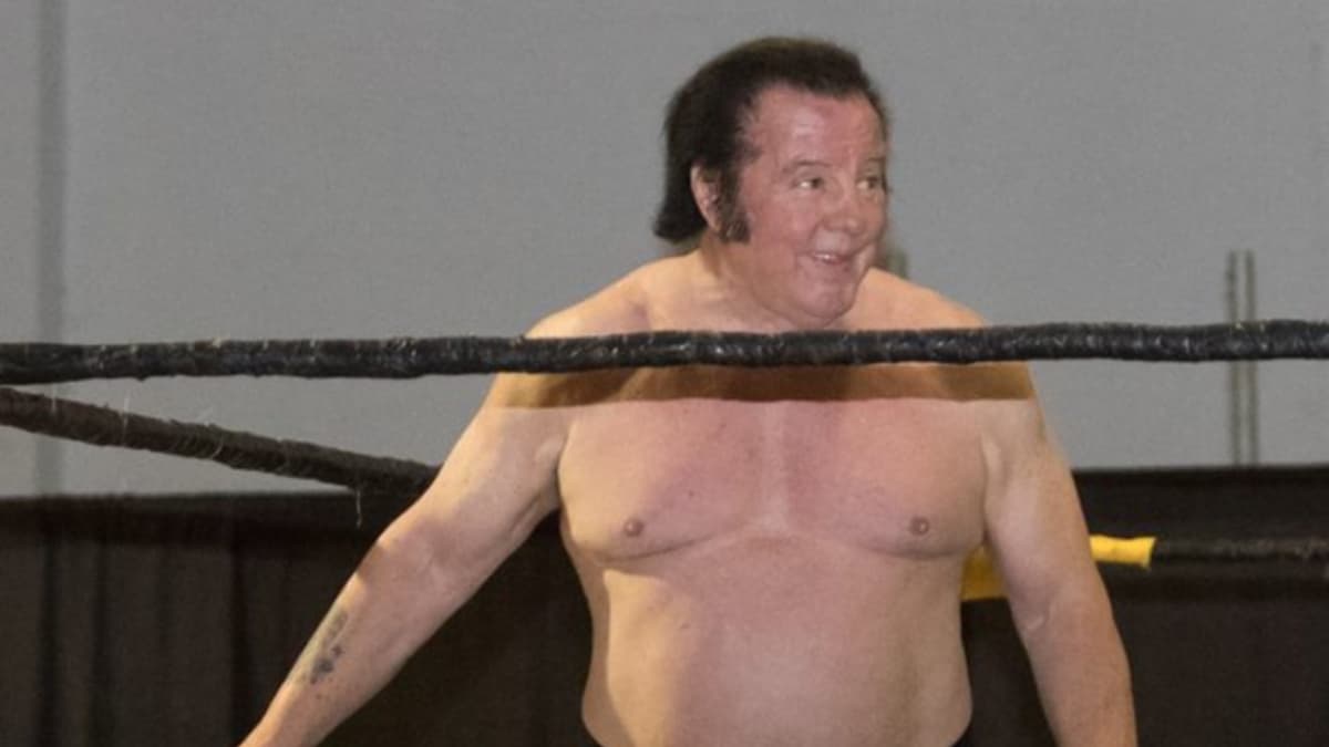Bill Dundee smiles inside a wrestling ring