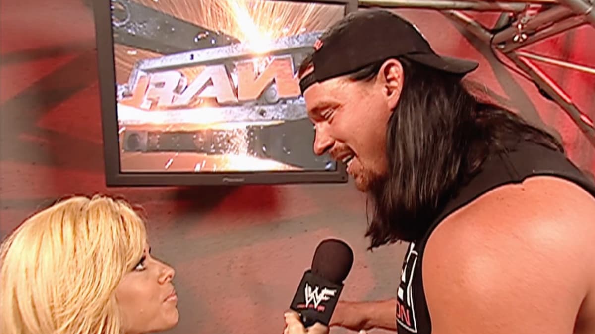 Bradshaw looking down while speaking to Terri in June 2002 on WWE Raw