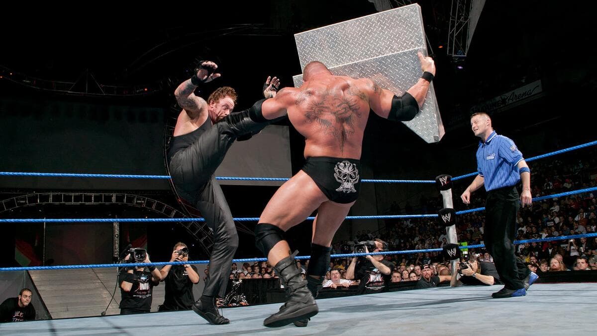 The Undertaker hitting big boot to Brock Lesnar at WWE No Mercy 2003
