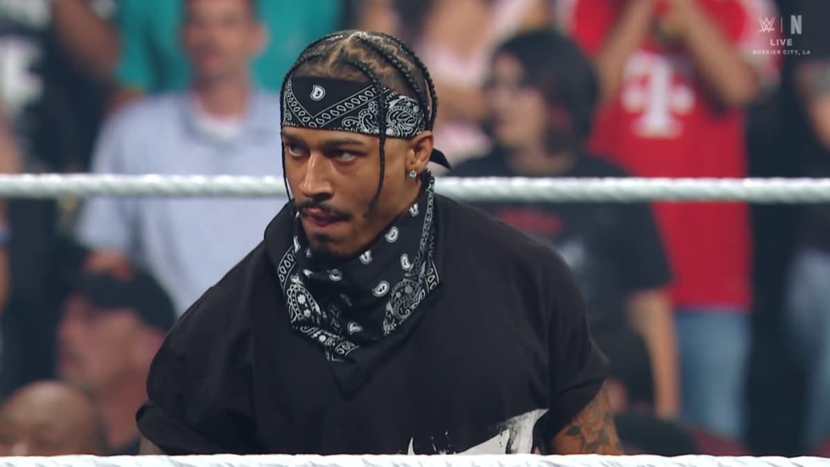 Carmelo Hayes in a bandana joining the 946