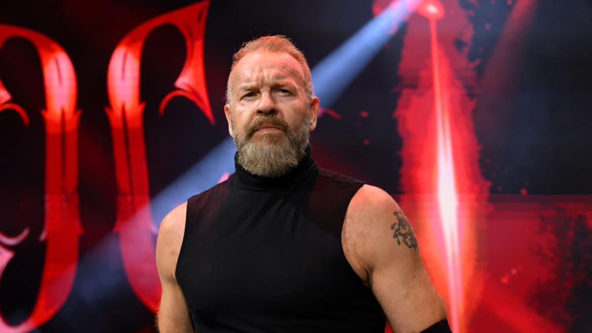 Christian Cage making his entrance in a black vest