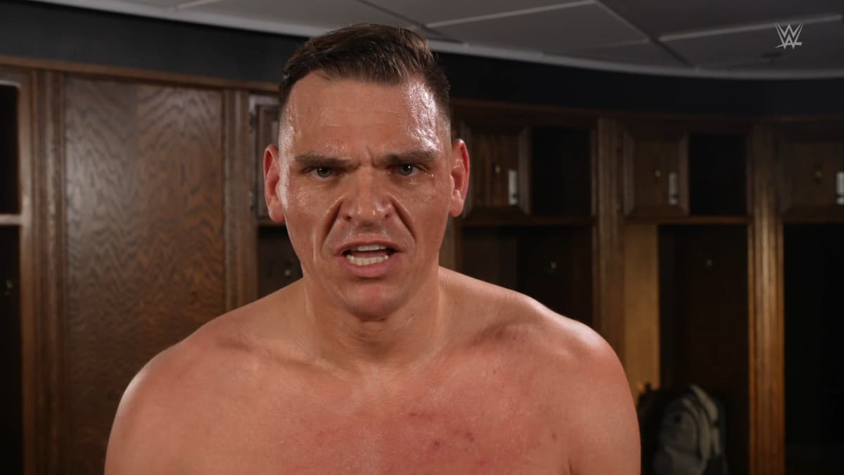 Gunther cutting a promo while topless in a locker room