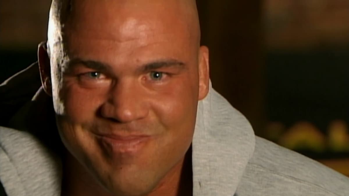Kurt Angle smirking with a towel around his neck