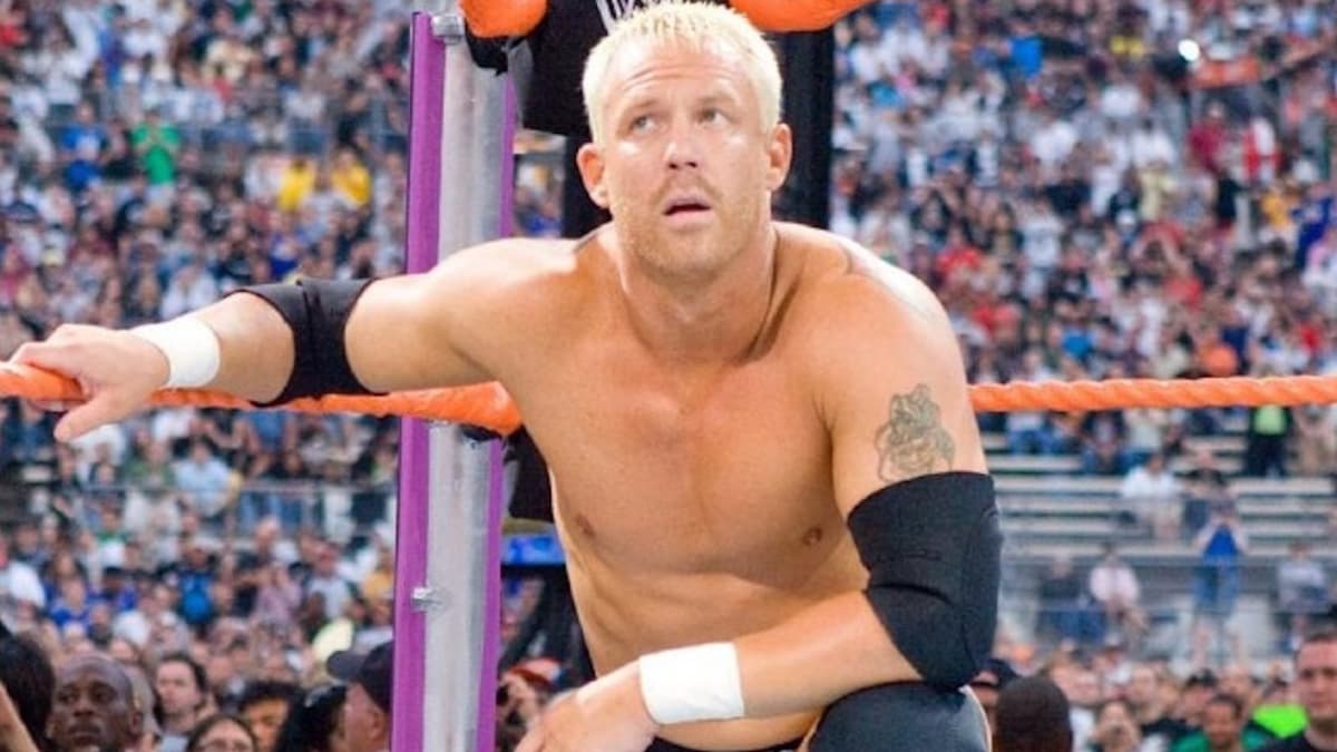 Mr. Kennedy crouching in the corner of a WWE ring