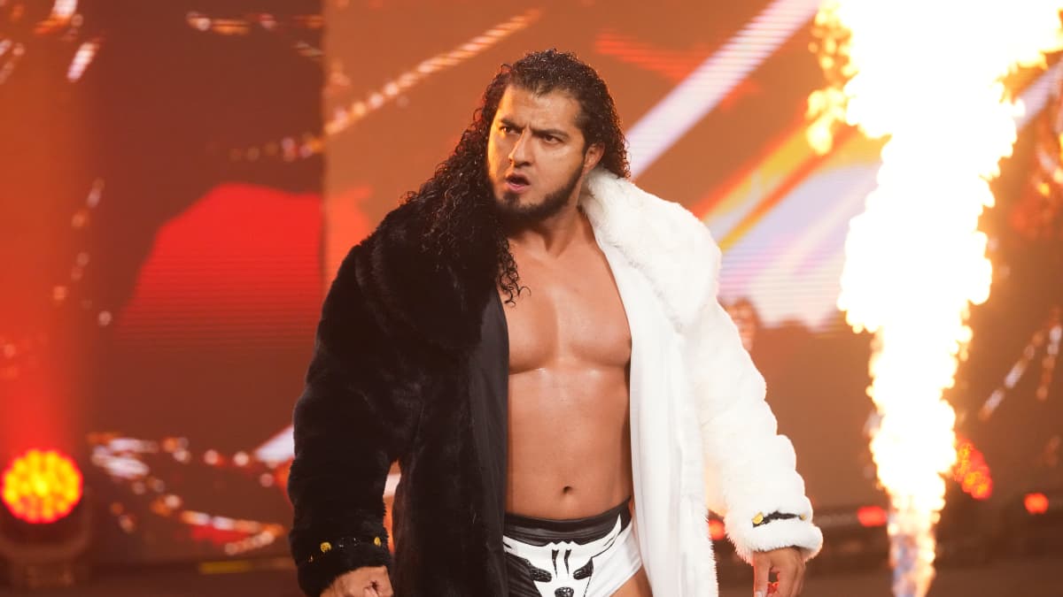 RUSH walking to the ring with flames spitting behind him