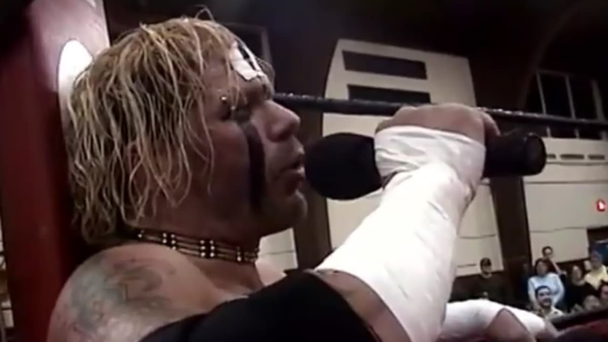Raven sitting down cutting a promo in Ring of Honor in 2003