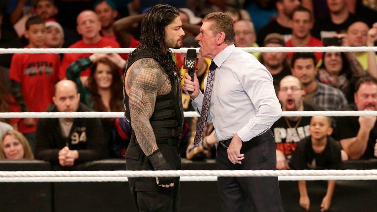 Roman Reigns squaring off with Vince McMahon