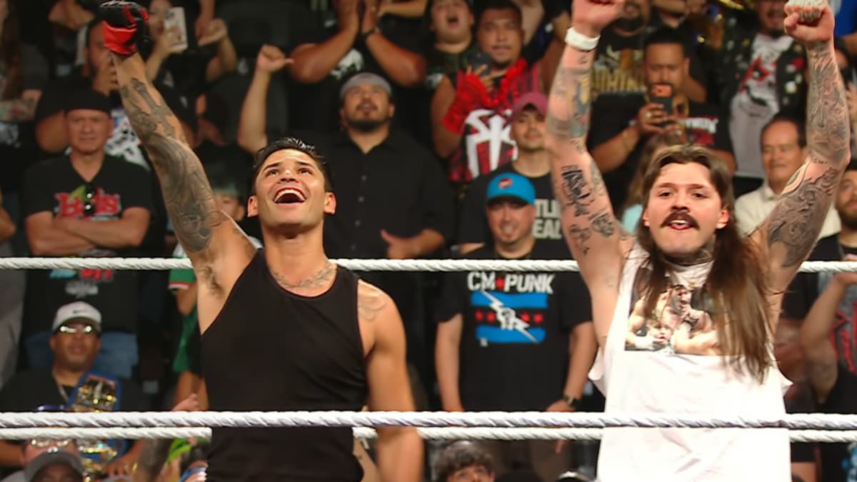 Ryan Garcia celebrating with Dominik Mysterio at WWE Raw