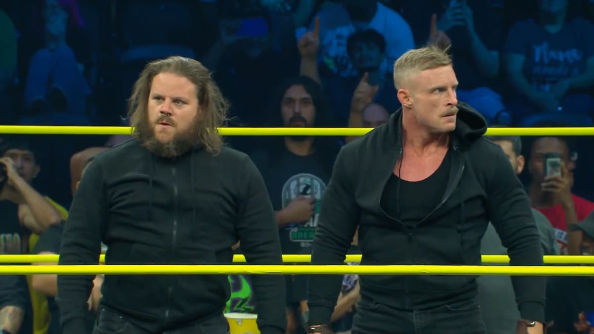 Joseph Sawyer and Samuel Shaw in hoodies in a wrestling ring