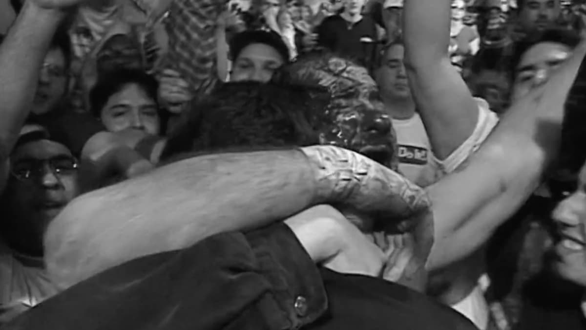 Terry Funk hugging Tommy Dreamer at ECW Barely Legal on a black and white image