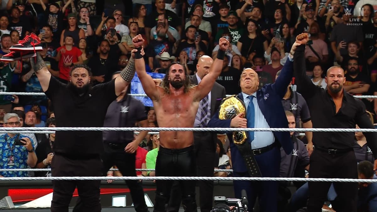 The Vision - Bronson Reed, Seth Rollins, Paul Heyman and Bron Breaker - stand with their hands raised in the middle of the ring