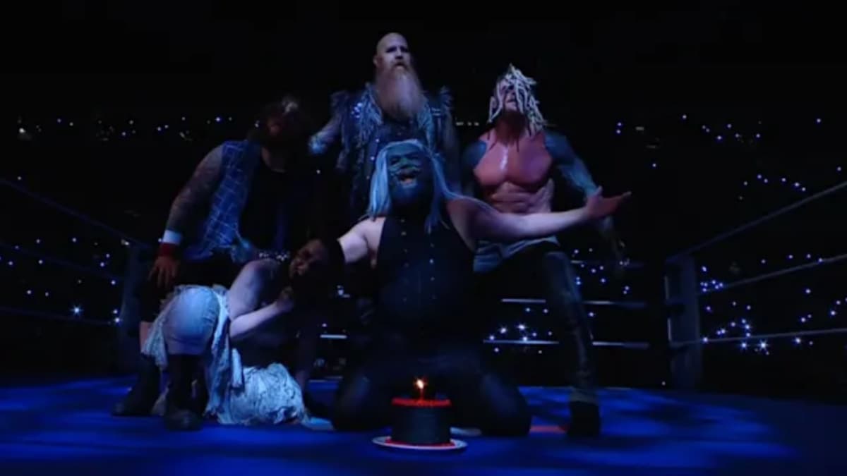 The Wyatt Sicks in the ring with a birthday cake