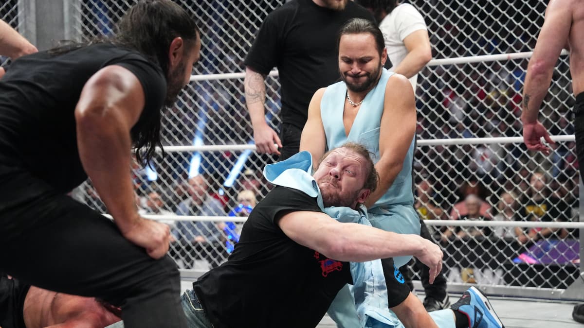 Nick Jackson choking Kenny Omega with his jacket at AEW Dynamite Beach Break