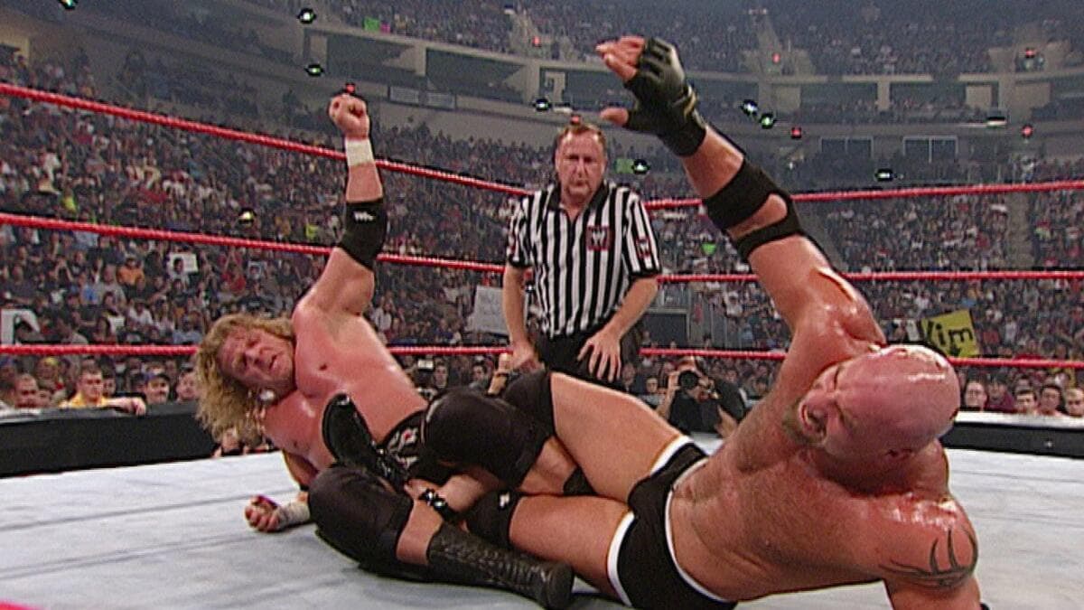 Triple H and Goldberg in a Figure Gour Leglock turning over at WWE Unforgiven 2003