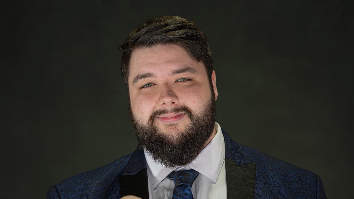 Walker Stewart smiling in a suit