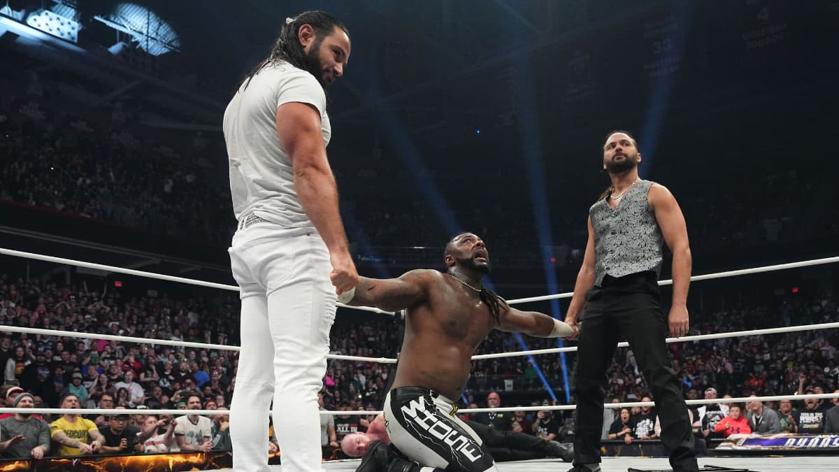 The Young Bucks holding Swerve Strickland's arms at AEW Dynasty 2025