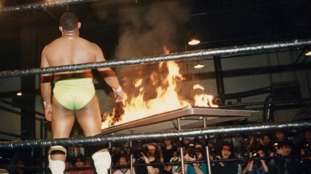 2 Cold Scorpio standing next to a flaming table