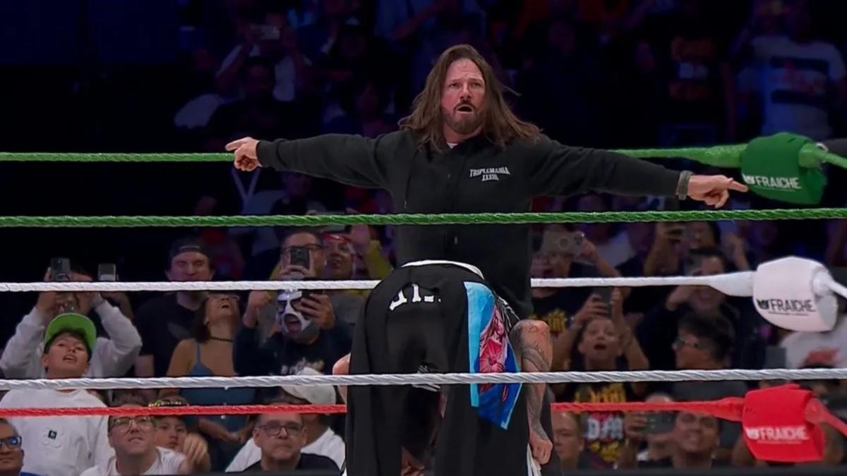 AJ Styles attacking Dominik Mysterio 