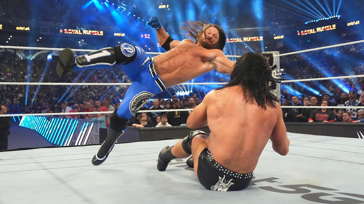 AJ Styles hitting a running forearm to Drew McIntyre at WWE Royal Rumble 2025