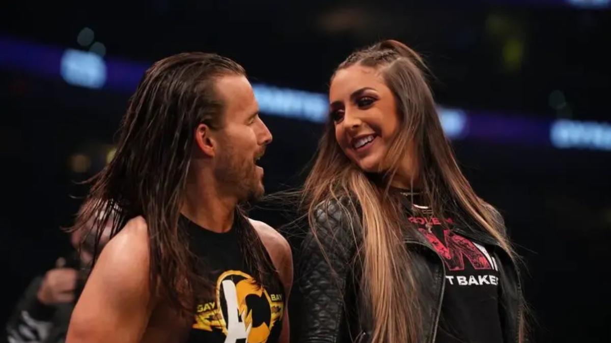 Adam Cole and Britt Baker looking into each other's eyes in 2022