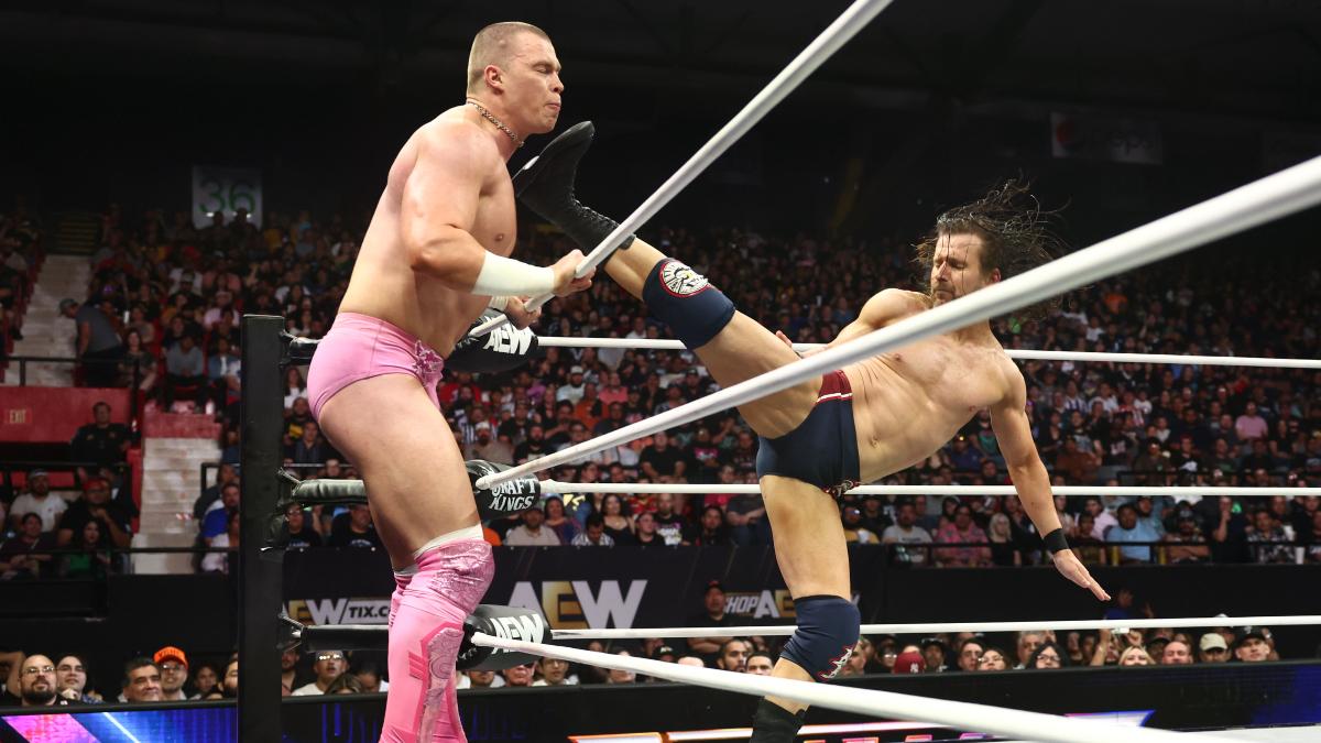 Adam Cole hitting a superkick to Kyle Fletcher