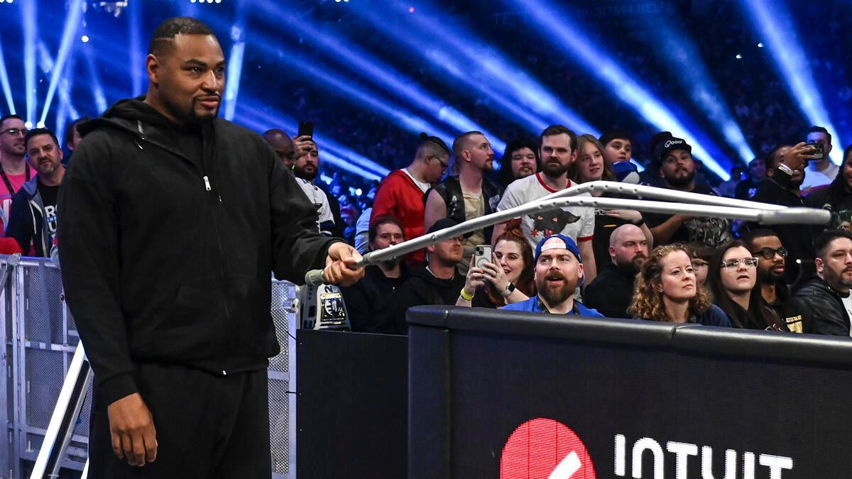 Angel Dawkins holds his crutch after interfering in the match between DIY and the Motor City Machine Guns at Royal Rumble 2025