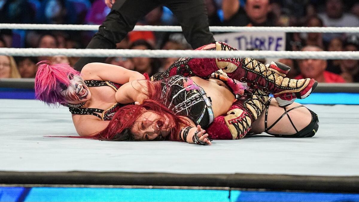 Asuka with IYO SKY in a submission on a 2023 episode of SmackDown