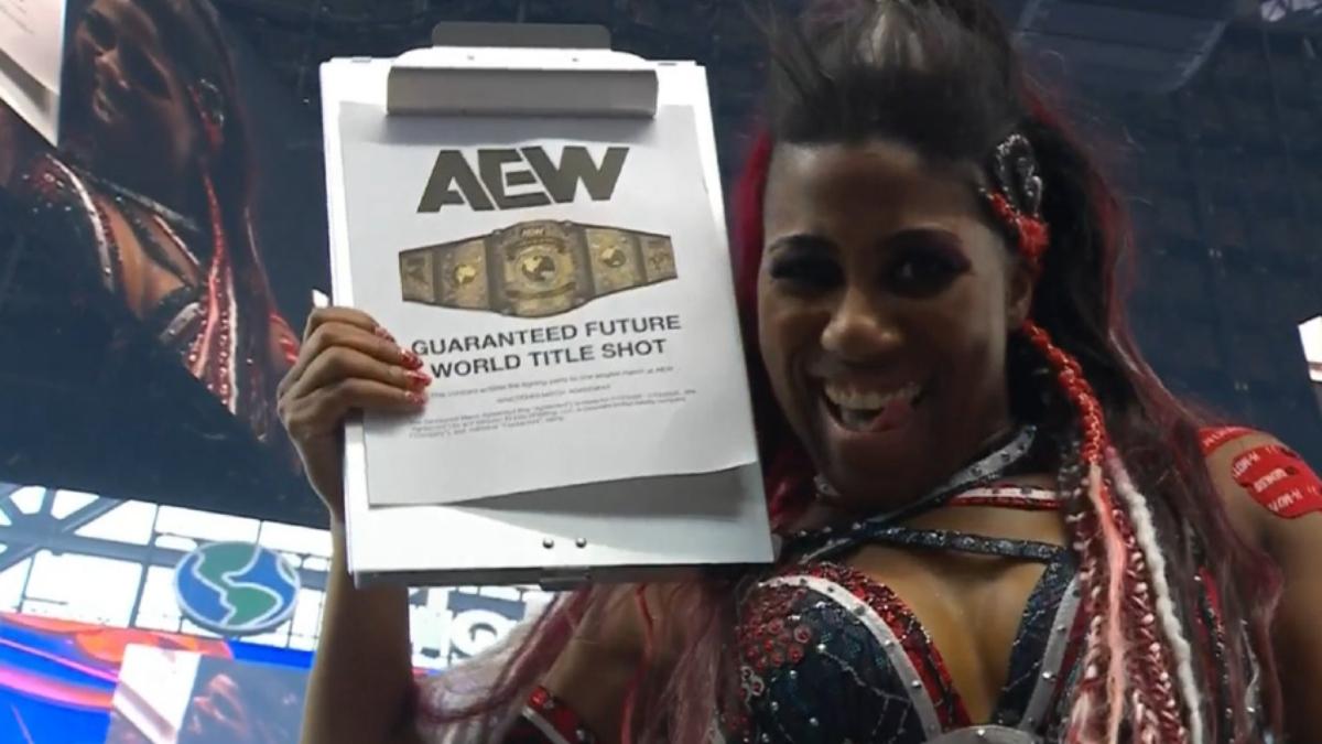 Athena holds up a contract in an AEW ring