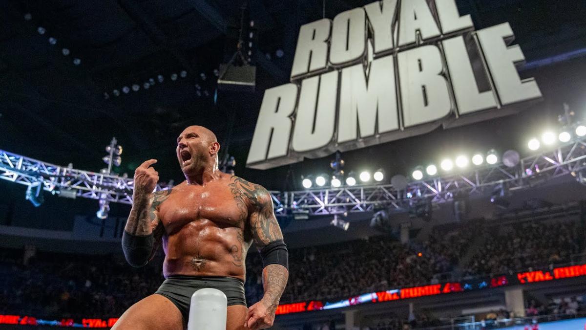 Batista celebrating his WWE Royal Rumble 2014 win by standing on the top turnbuckle and screaming