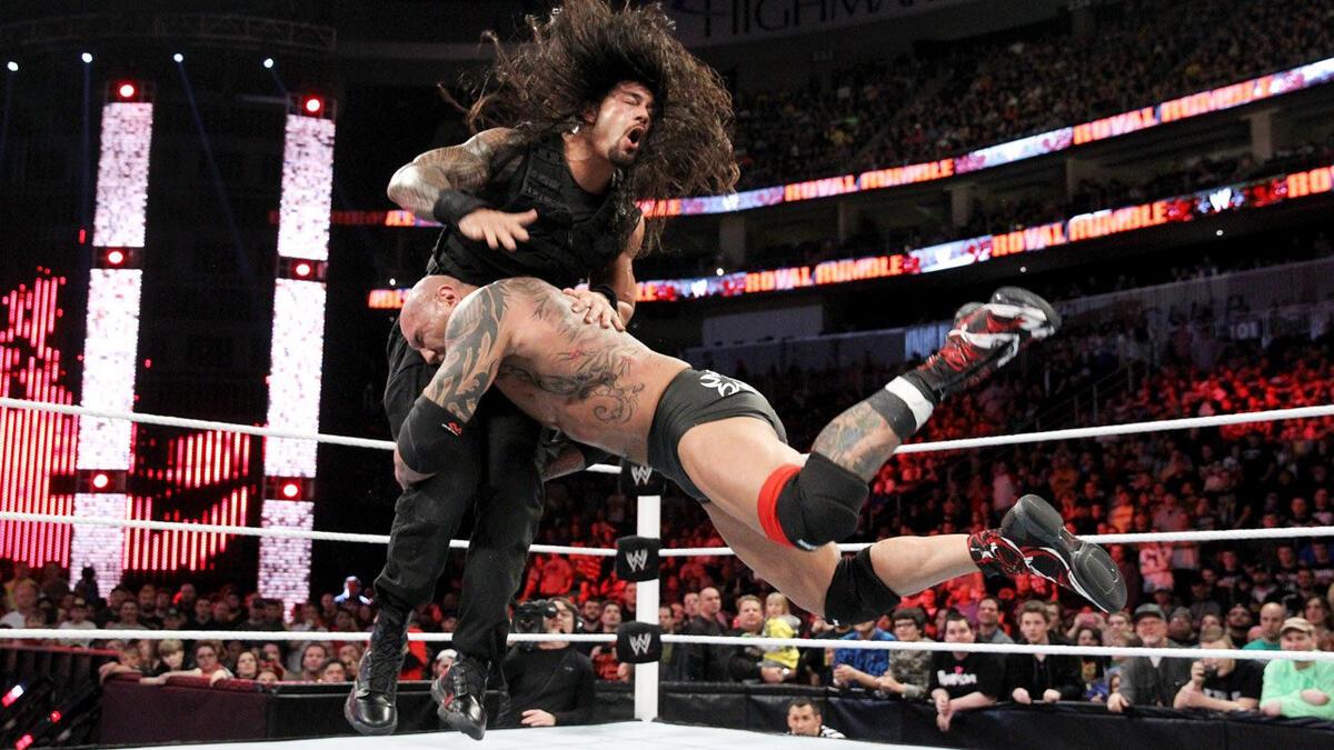 Batista spearing Roman Reigns during the 2014 Royal Rumble match