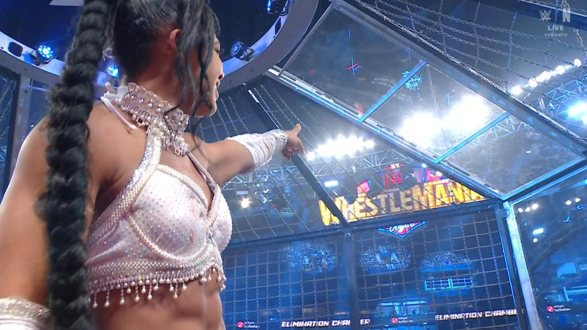 Bianca Belair pointing at WrestleMania sign at WWE Elimination Chamber