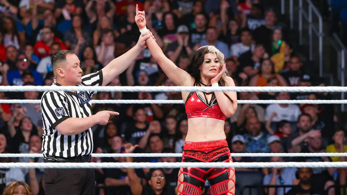 Blair Davenport on WWE SmackDown with her arm raised