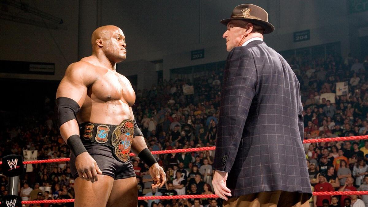 Bobby Lashley and Vince McMahon stand face-to-face in the ring during a 2007 episode of WWE Raw