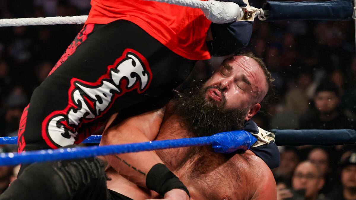 Braun Strowman firing spit into the air following a hip attack in the corner from Jacob Fatu at WWE Saturday Night's Main Event