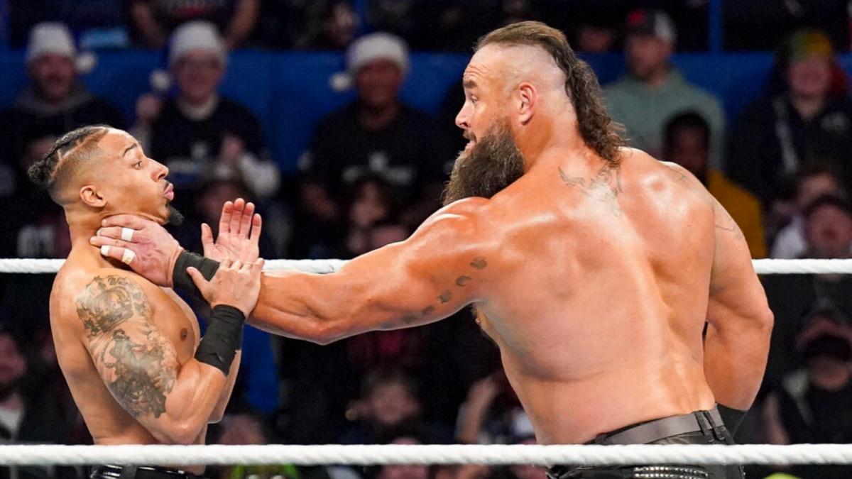 Braun Strowman choking a scared Carmelo Hayes