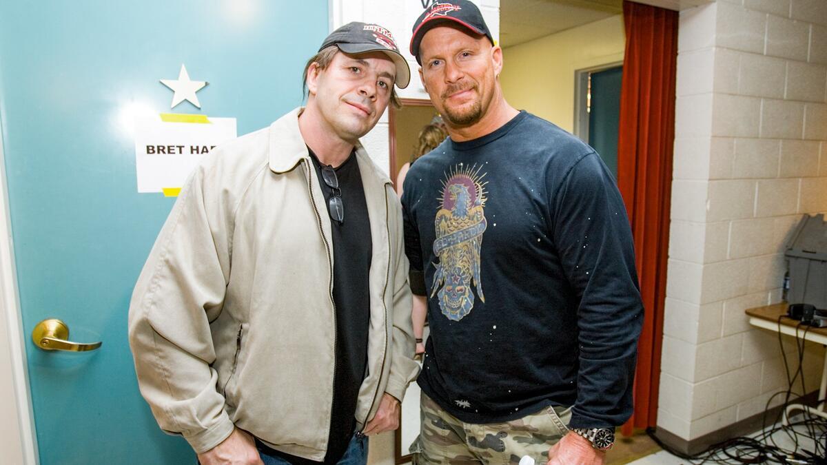 Bret Hart and Steve Austin pose for a photo together backstage before the 2006 WWE Hall of Fame ceremony