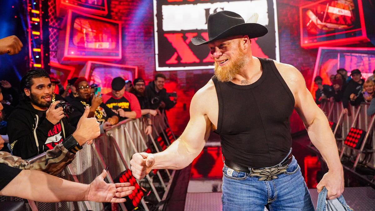 Brock Lesnar giving a fist bump to a fan at WWE Raw 30th anniversary