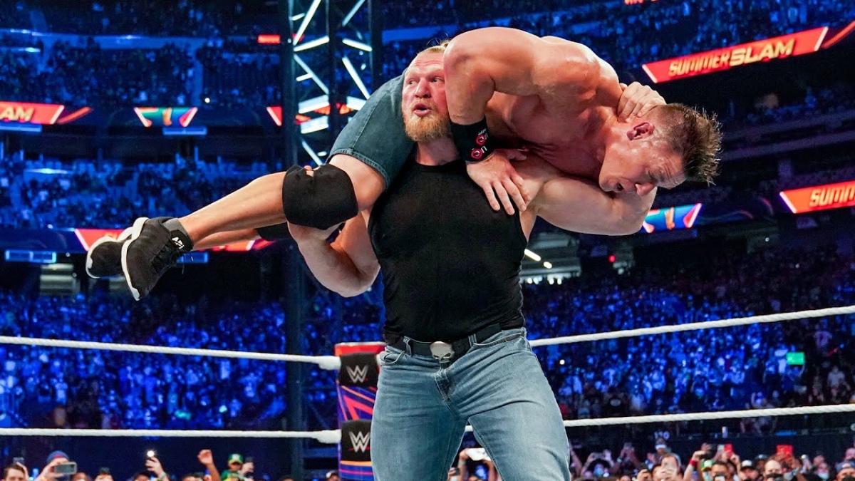 Brock Lesnar with John Cena on his shoulders before an F5 at WWE SummerSlam 2021