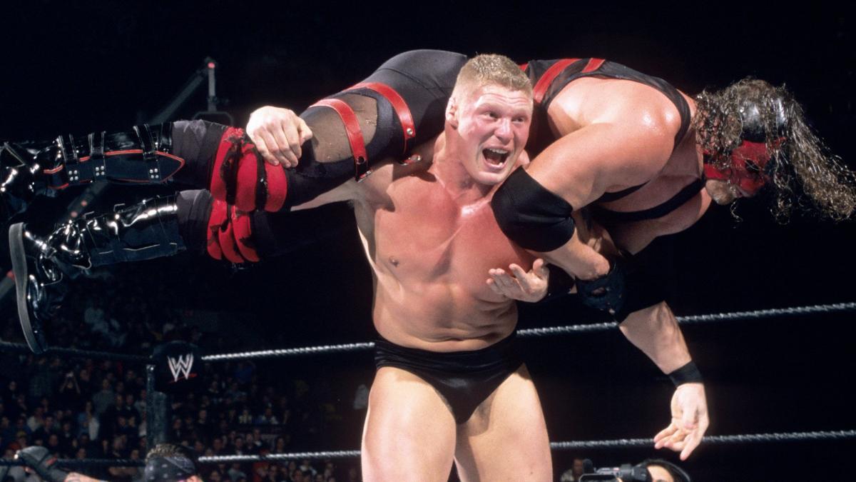 Brock Lesnar with Kane on his shoulders at WWE Royal Rumble 2013