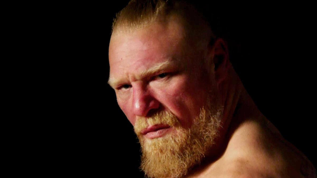 A closeup shot of WWE star Brock Lesnar's face against a black background.