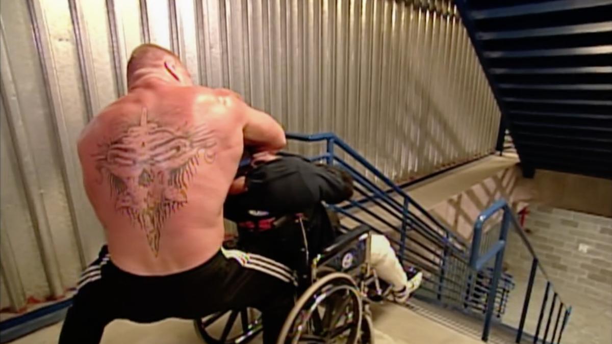 Brock Lesnar choking Zach Gowen before pushing him down stairs