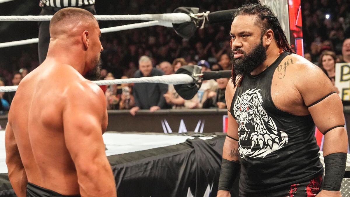 Bron Breakker and Jacob Fatu facing off at ringside on WWE Raw