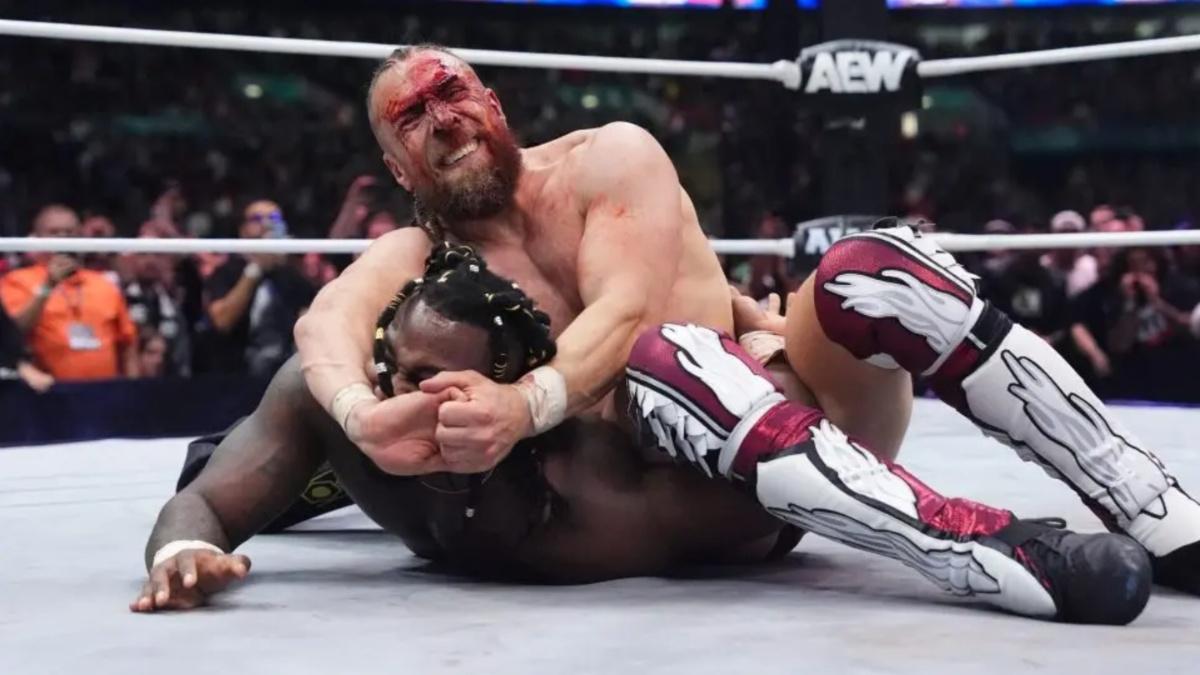 Bryan Danielson with a submission hold on Swerve Strickland 