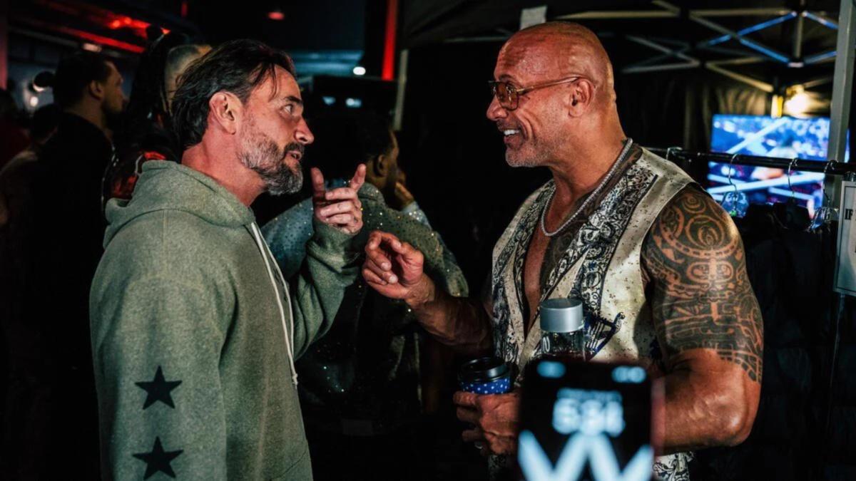 CM Punk and The Rock talking to each other 