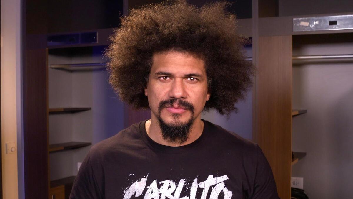 WWE star Carlito looks directly into the camera during a backstage promo in 2024