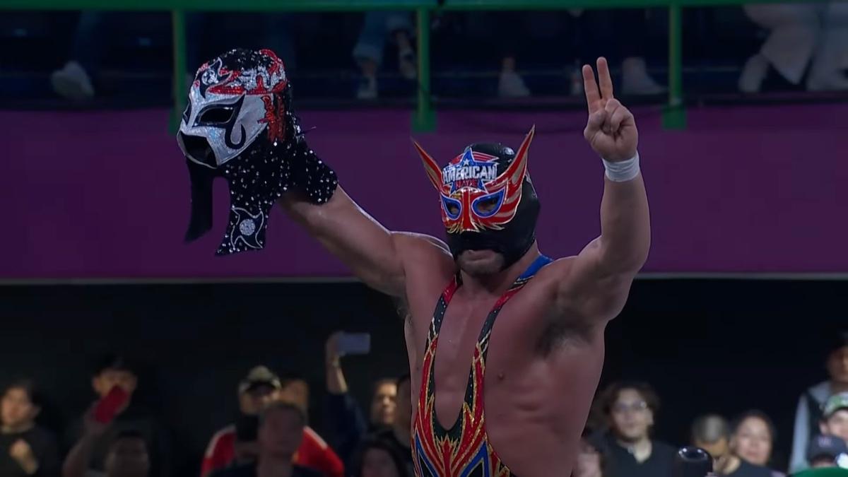 Chad Gable holding up Octagon Jr's mask in AAA